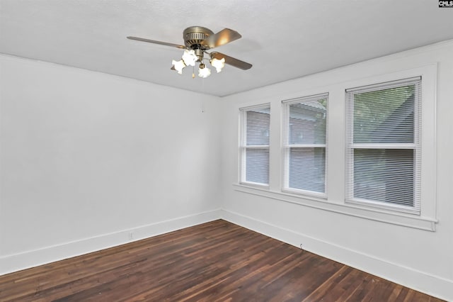 709 Sunset Dr, Columbia, SC 29203 - empty room featuring baseboards, dark wood-style flooring, and a ceiling fan
