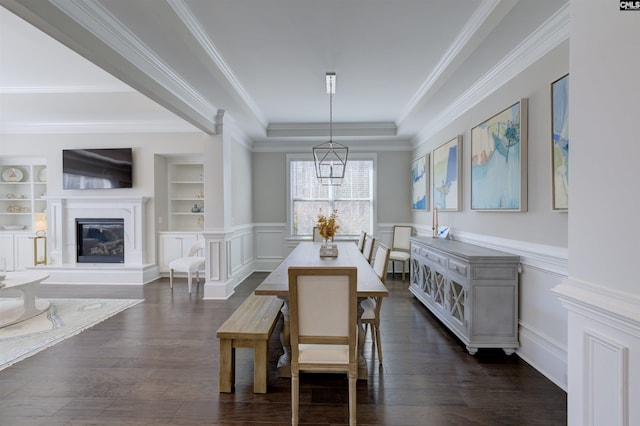 2 Beaver Lake Ct, Elgin, SC 29045 - dining area featuring a wainscoted wall, dark wood finished floors, ornamental molding, a glass covered fireplace, and a decorative wall