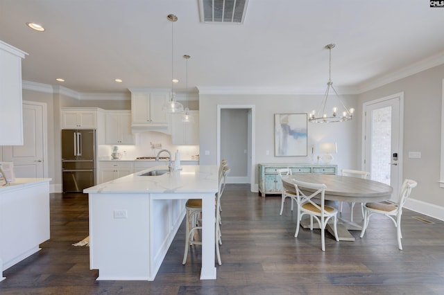 2 Beaver Lake Ct, Elgin, SC 29045 - kitchen featuring high end fridge, a chandelier, white cabinetry, ornamental molding, and a sink