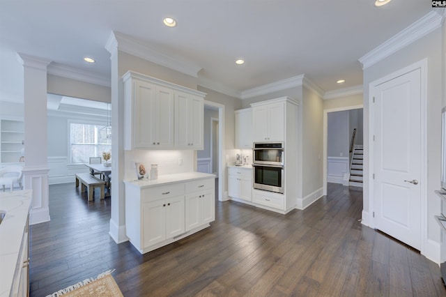 2 Beaver Lake Ct, Elgin, SC 29045 - kitchen featuring double oven, dark wood-style floors, white cabinetry, recessed lighting, and ornamental molding