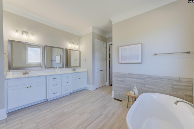 2 Beaver Lake Ct, Elgin, SC 29045 - bathroom featuring a freestanding tub, double vanity, tile walls, and crown molding