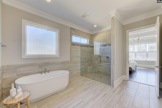 2 Beaver Lake Ct, Elgin, SC 29045 - ensuite bathroom featuring a freestanding tub, a stall shower, crown molding, tile walls, and recessed lighting
