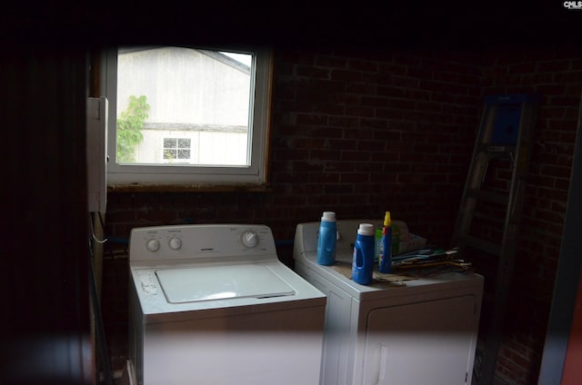 828 Seay Dr, West Columbia, SC 29170 - washroom with washing machine and clothes dryer and brick wall