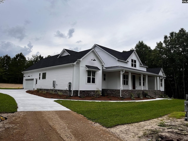 1781 Bookman Rd, Elgin, SC 29045 - view of property exterior featuring driveway, a yard, a porch, and an attached garage
