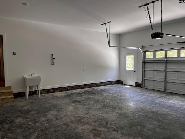 1781 Bookman Rd, Elgin, SC 29045 - garage featuring a garage door opener and baseboards