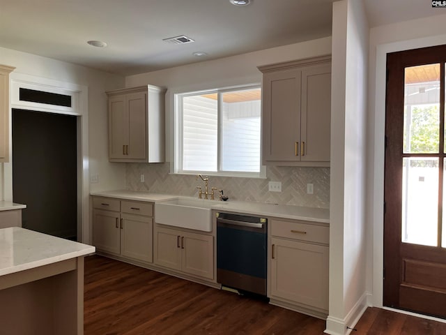 1781 Bookman Rd, Elgin, SC 29045 - kitchen featuring stainless steel dishwasher, a sink, dark wood-type flooring, decorative backsplash, and recessed lighting