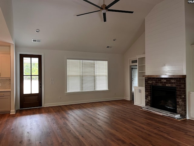 1781 Bookman Rd, Elgin, SC 29045 - unfurnished living room featuring a ceiling fan, dark wood-style floors, high vaulted ceiling, a brick fireplace, and baseboards