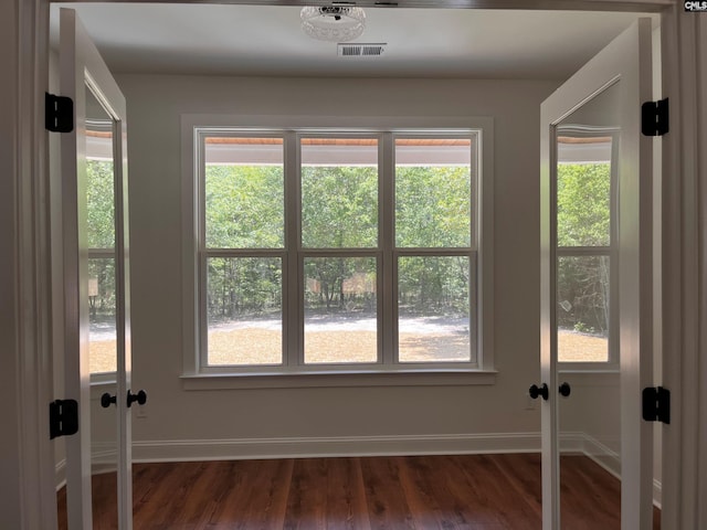 1781 Bookman Rd, Elgin, SC 29045 - unfurnished room featuring dark wood finished floors, baseboards, and healthy amount of natural light