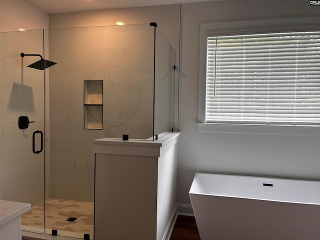 1781 Bookman Rd, Elgin, SC 29045 - bathroom featuring a stall shower, a freestanding bath, and baseboards