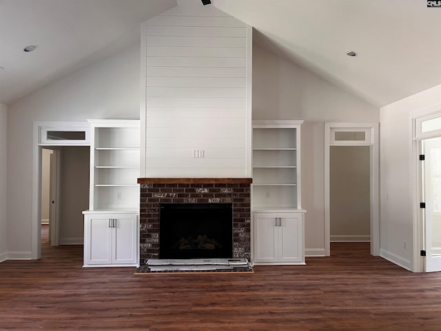 1781 Bookman Rd, Elgin, SC 29045 - unfurnished living room featuring lofted ceiling, dark wood finished floors, baseboards, and a fireplace