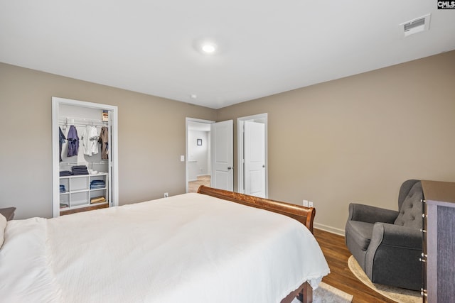 133 Plum Orchard Dr, West Columbia, SC 29170 - bedroom featuring wood finished floors, a spacious closet, baseboards, and a closet