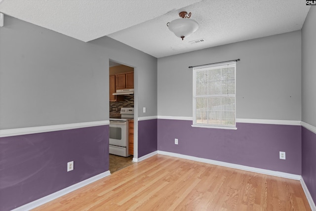2 Berry Ridge Ct, Columbia, SC 29229 - unfurnished room with light wood finished floors, baseboards, and a textured ceiling