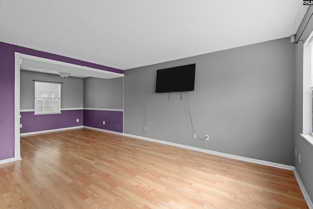 2 Berry Ridge Ct, Columbia, SC 29229 - empty room with light wood finished floors, baseboards, and a textured ceiling