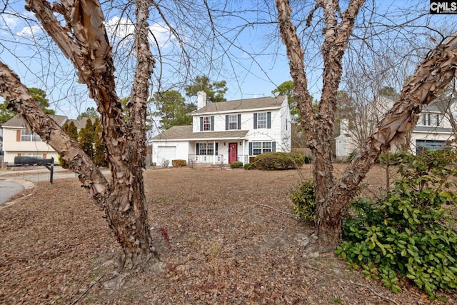 2 Berry Ridge Ct, Columbia, SC 29229 - view of front of home with a chimney, an attached garage, and covered porch
