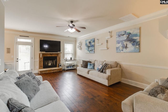 454 Henslowe Ln, West Columbia, SC 29170 - living area featuring ceiling fan, ornamental molding, a stone fireplace, dark wood-style floors, and plenty of natural light