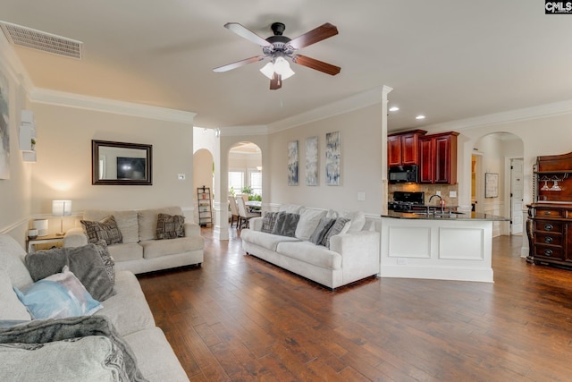 454 Henslowe Ln, West Columbia, SC 29170 - living area featuring arched walkways, crown molding, ceiling fan, dark wood-style flooring, and recessed lighting