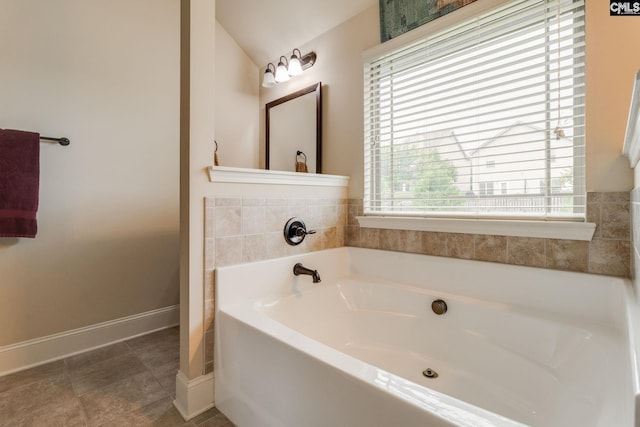 454 Henslowe Ln, West Columbia, SC 29170 - full bathroom featuring a bath, vaulted ceiling, and baseboards