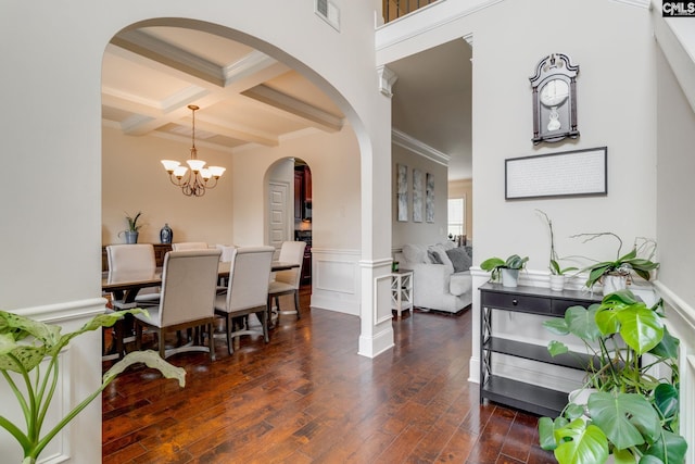 454 Henslowe Ln, West Columbia, SC 29170 - dining area with arched walkways, beamed ceiling, a chandelier, crown molding, and dark wood finished floors