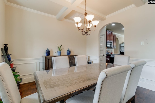 454 Henslowe Ln, West Columbia, SC 29170 - dining area with arched walkways, crown molding, a chandelier, dark wood-style floors, and a wainscoted wall