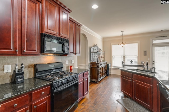 454 Henslowe Ln, West Columbia, SC 29170 - kitchen featuring black appliances, dark brown cabinets, a sink, dark wood-type flooring, and arched walkways