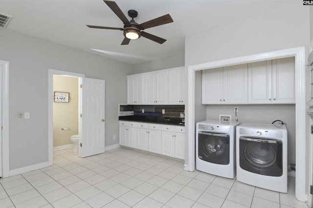 109 Quiet Cove Dr, Chapin, SC 29036 - laundry area with washing machine and dryer, cabinet space, ceiling fan, baseboards, and light tile patterned floors