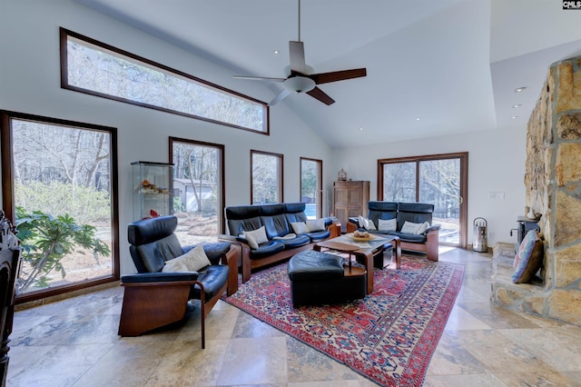 208 Gibbs Rd, Elgin, SC 29045 - living area with high vaulted ceiling, stone tile floors, and a ceiling fan