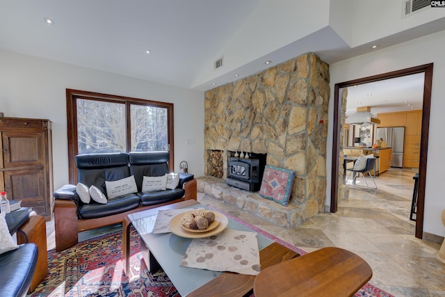 208 Gibbs Rd, Elgin, SC 29045 - living room featuring a wood stove, lofted ceiling, and recessed lighting