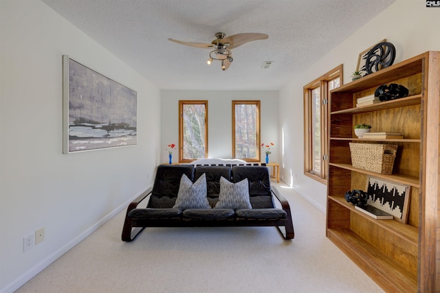 208 Gibbs Rd, Elgin, SC 29045 - living area featuring a ceiling fan, carpet floors, a textured ceiling, and baseboards