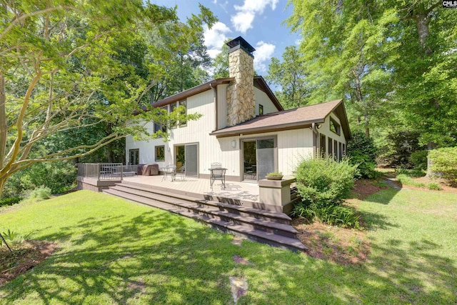 208 Gibbs Rd, Elgin, SC 29045 - back of house featuring a chimney, a deck, and a yard