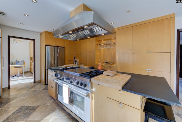 208 Gibbs Rd, Elgin, SC 29045 - kitchen with premium appliances, island exhaust hood, recessed lighting, baseboards, and wood counters