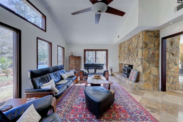 208 Gibbs Rd, Elgin, SC 29045 - living area with high vaulted ceiling, a wood stove, and ceiling fan