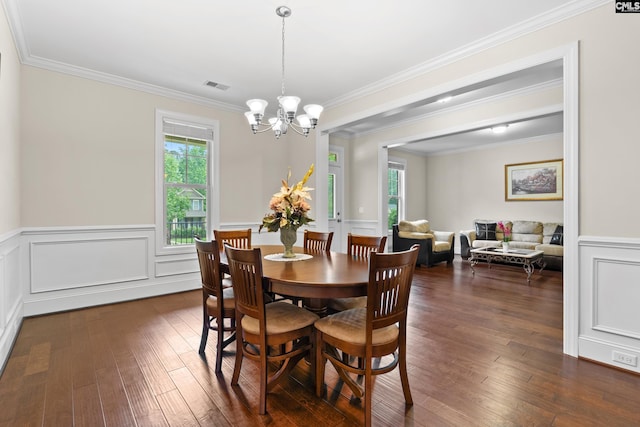 122 Lost Lure Ln, Chapin, SC 29036 - dining space featuring a chandelier, dark wood-style flooring, ornamental molding, wainscoting, and a decorative wall