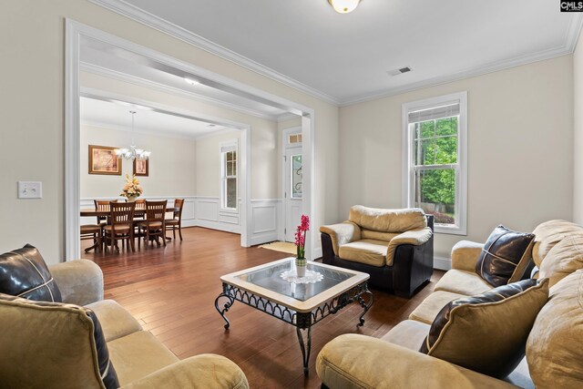 122 Lost Lure Ln, Chapin, SC 29036 - living area featuring hardwood / wood-style flooring, ornamental molding, wainscoting, and a chandelier