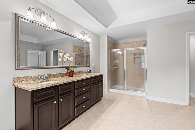 122 Lost Lure Ln, Chapin, SC 29036 - full bath featuring a shower stall, double vanity, baseboards, and tile patterned floors