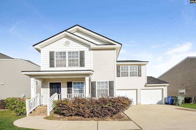 218 Sorrel Tree Dr, Columbia, SC 29223 - traditional-style home featuring driveway, a porch, central AC unit, and a garage