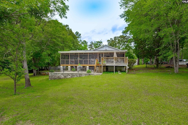 1805 Lakeshore Rd, Camden, SC 29020 - rear view of property with a sunroom, a yard, and a deck