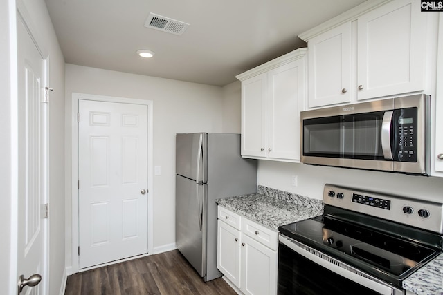 307 Sundew Rd, Elgin, SC 29045 - kitchen with appliances with stainless steel finishes, dark wood-type flooring, white cabinets, light stone countertops, and baseboards