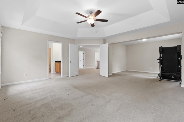 309 Tanners Mill Ct, Chapin, SC 29036 - unfurnished living room with a tray ceiling, a ceiling fan, light carpet, and baseboards