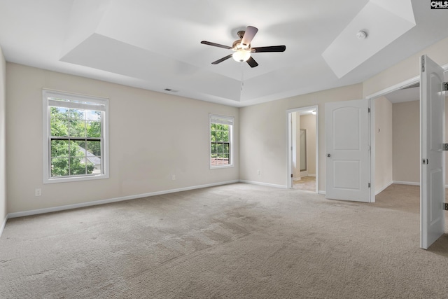 309 Tanners Mill Ct, Chapin, SC 29036 - unfurnished bedroom with a tray ceiling, carpet floors, baseboards, and a ceiling fan