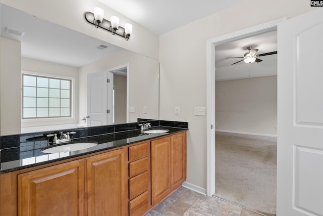 309 Tanners Mill Ct, Chapin, SC 29036 - full bathroom featuring double vanity, baseboards, and ceiling fan
