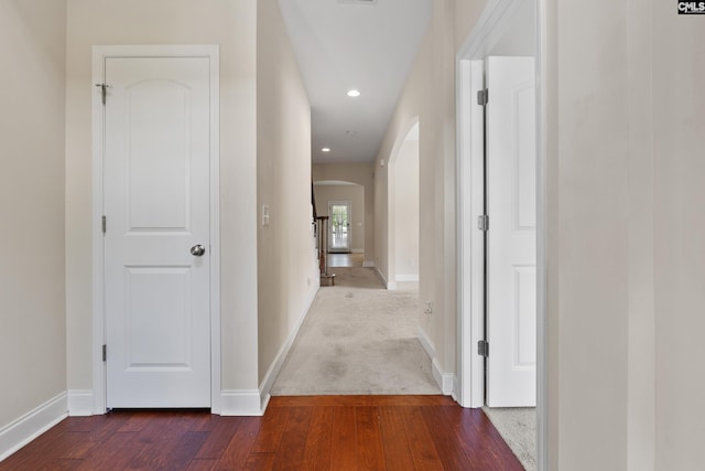 309 Tanners Mill Ct, Chapin, SC 29036 - hallway featuring arched walkways, dark wood-style floors, baseboards, and recessed lighting