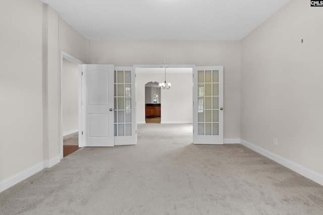 309 Tanners Mill Ct, Chapin, SC 29036 - carpeted spare room with french doors, a chandelier, baseboards, and arched walkways