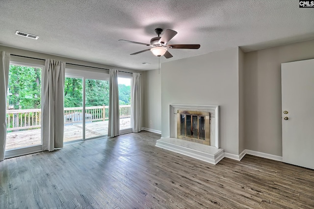 1820 Elm Abode Ter, Columbia, SC 29210 - unfurnished living room with a ceiling fan, a textured ceiling, wood finished floors, baseboards, and a glass covered fireplace