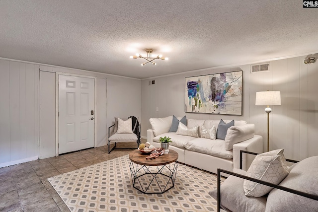 1820 Elm Abode Ter, Columbia, SC 29210 - living room with a decorative wall, a chandelier, crown molding, and a textured ceiling