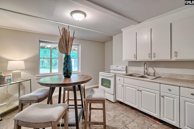 1820 Elm Abode Ter, Columbia, SC 29210 - kitchen featuring white range with electric cooktop, a sink, white cabinetry, light countertops, and light tile patterned floors
