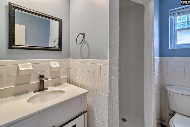 1820 Elm Abode Ter, Columbia, SC 29210 - full bath with tile walls, toilet, a stall shower, vanity, and a wainscoted wall