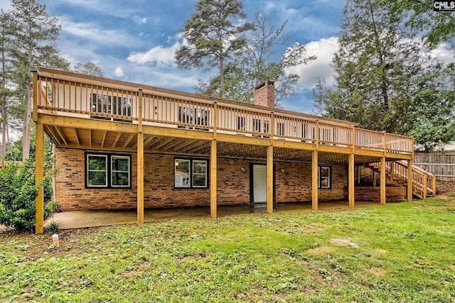 1820 Elm Abode Ter, Columbia, SC 29210 - back of property with a deck, a chimney, a lawn, brick siding, and stairs