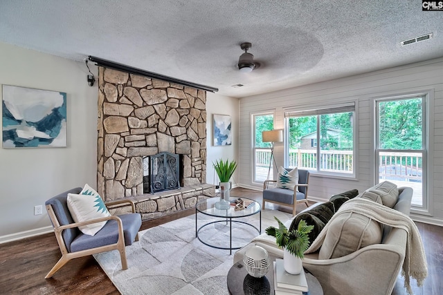 1820 Elm Abode Ter, Columbia, SC 29210 - living area featuring wood finished floors, baseboards, a fireplace, and a textured ceiling