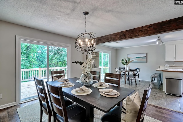 1820 Elm Abode Ter, Columbia, SC 29210 - dining area featuring a chandelier, baseboards, beamed ceiling, light wood-style floors, and a textured ceiling
