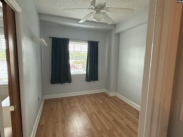2002 Greene St Unit 113, Columbia, SC 29205 - unfurnished room featuring light wood-style flooring, a textured ceiling, ceiling fan, and baseboards